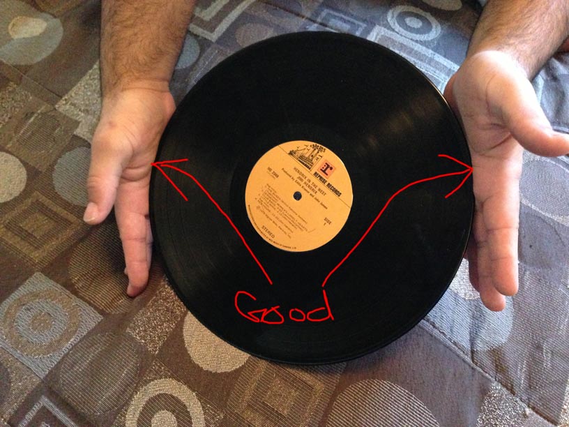 how to handle vinyl records properly